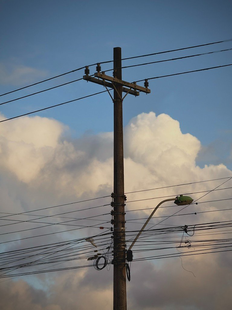 utility pole and cloudy sky